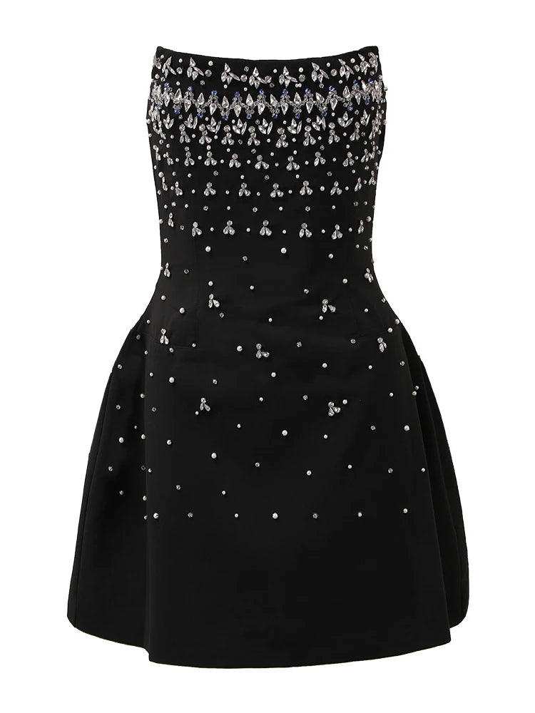 Black strapless dress with silver embellishments on a white background