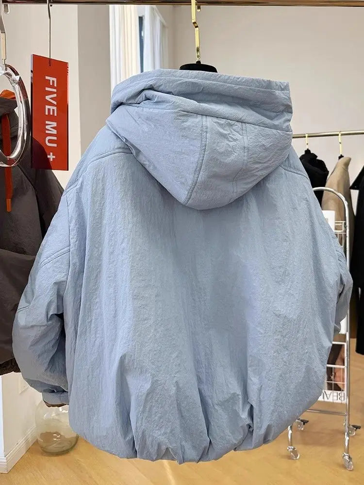 Light blue hooded jacket on a hanger