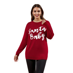 Woman wearing a red sweater with 'Santa Baby' text