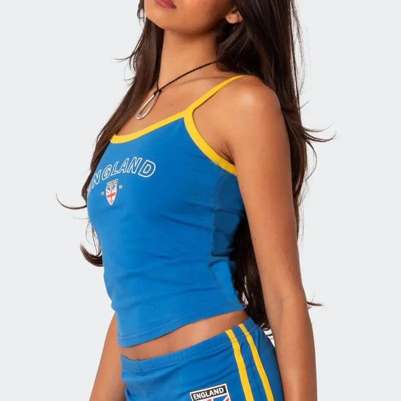Model displaying a short country flag graphic tank top with England