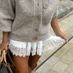 Women's high waist lace pleated mini skirt with a dot pattern and A-line silhouette.