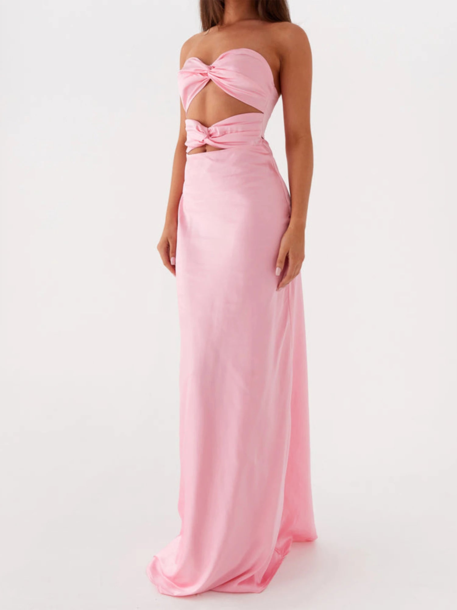 Pink strapless gown with a bow detail on a white background