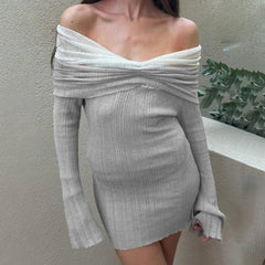 Woman wearing a gray off-shoulder dress against a neutral background