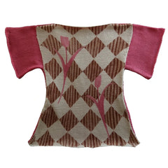 Small knitted sweater with pink sleeves and a geometric pattern on a white background