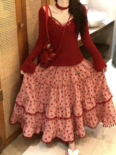 Women's red strawberry print tassel long skirt with tiered ruffles.