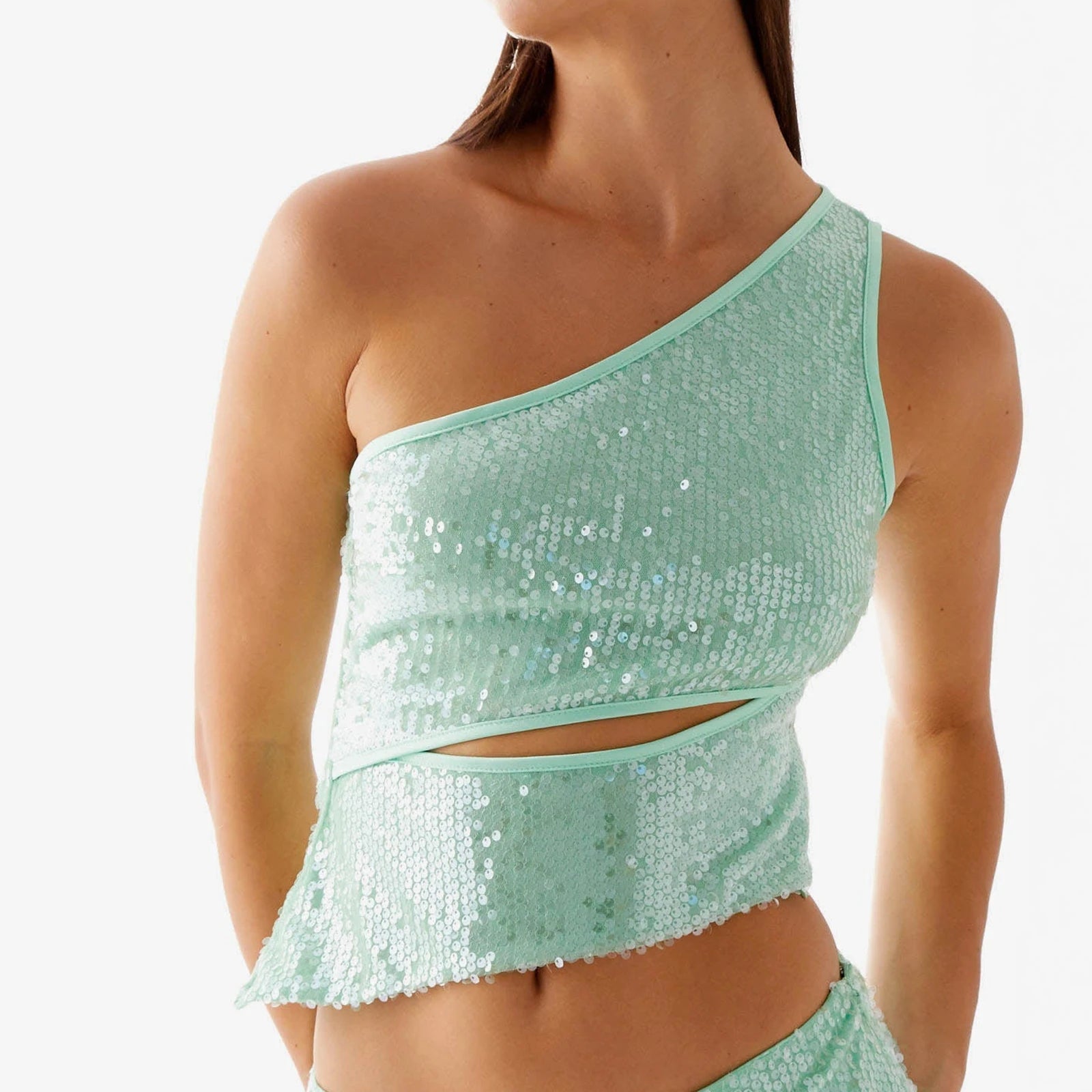 Mint green sequin top worn by a model - close-up view