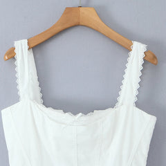 Women's white solid mini dress with a corset bodice and ruffled straps.