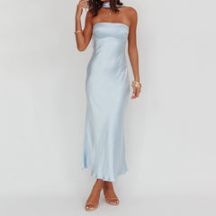 Woman wearing a light blue strapless gown - tube dress