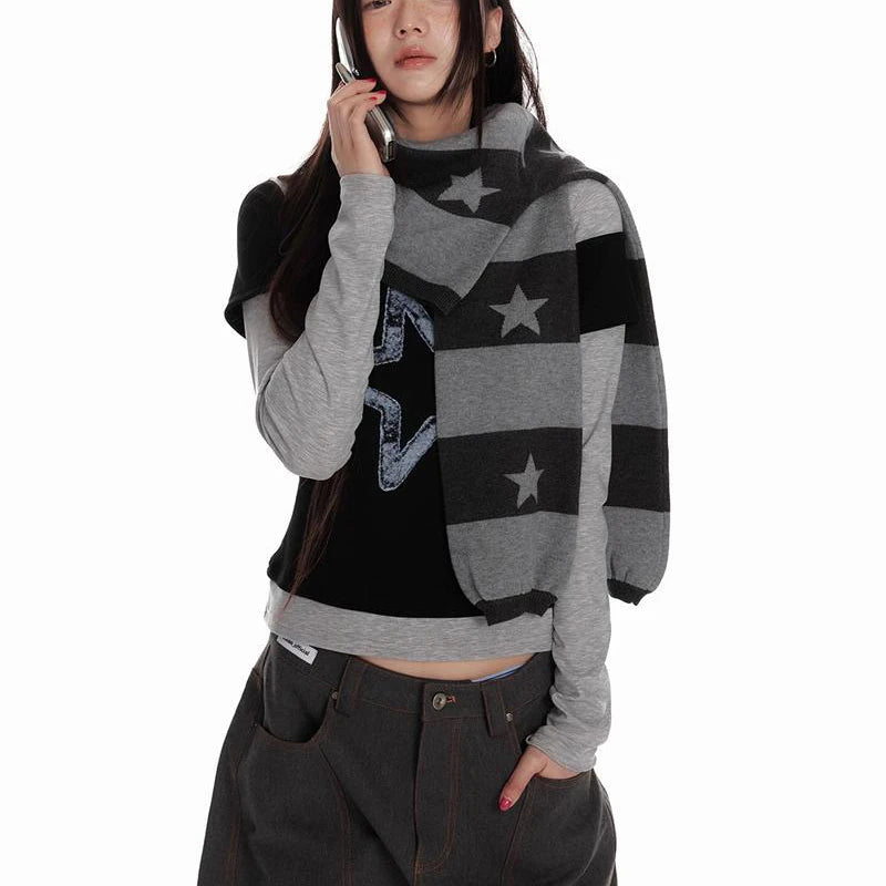 Person wearing a black and gray patterned sweater with stars