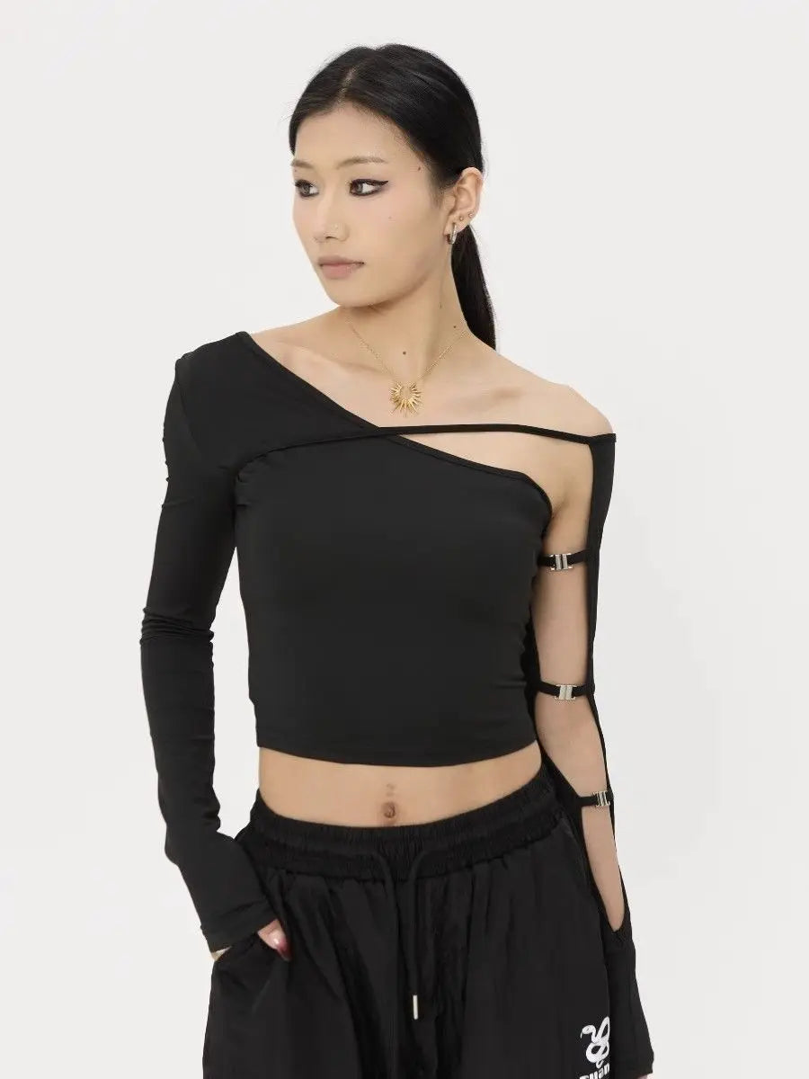 Woman wearing a black one-shoulder top with mesh cutouts