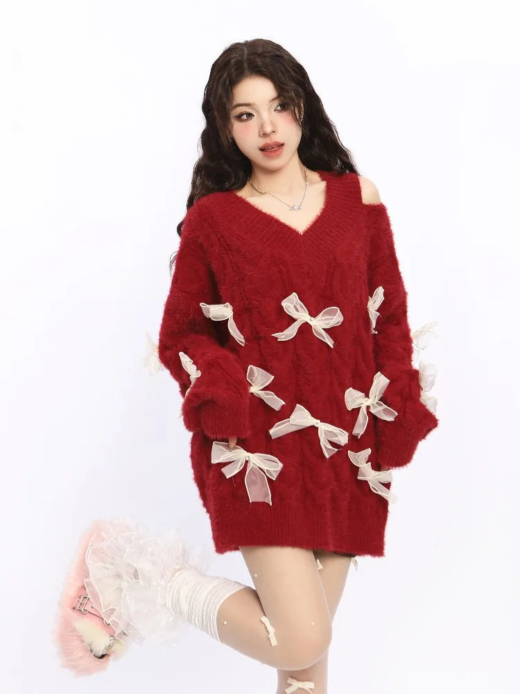 Red sweater with white bows worn by a person