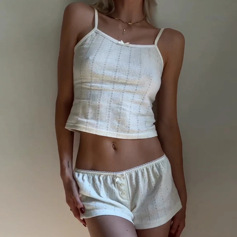 Women's sleeveless two piece pajama short set for lounging.