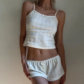 Women's sleeveless two piece pajama short set for lounging.
