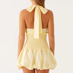 Yellow dress with a halter neck and bow detail - back view