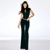 Woman wearing a black outfit on a white background