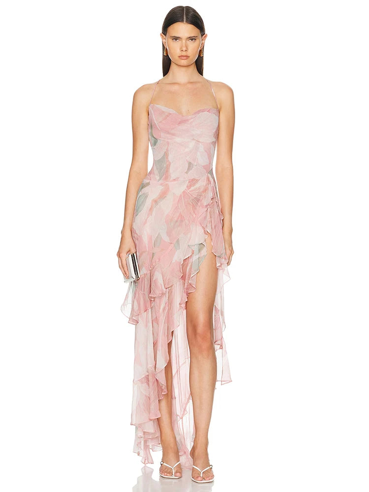 Woman wearing a pink floral dress on a white background