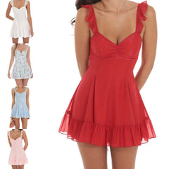 Model displaying a floral print mini dress with ruffles, straps, and an open back.