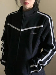 Black tracksuit with white stripes on a plain background