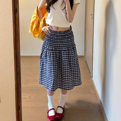 Women's blue elastic high waist plaid skirt with A-line silhouette.