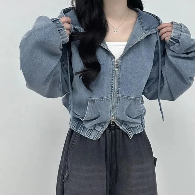 Person wearing a blue denim jacket