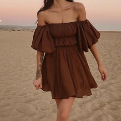 Women's off-shoulder ruched A-line mini dress with puff sleeves.