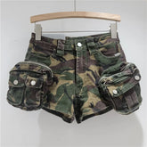 Camouflage shorts with multiple pockets on a wooden hanger against a white background