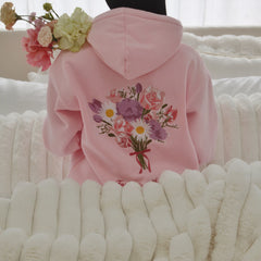 Pink hoodie with floral design