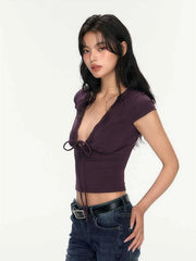 Woman wearing a purple top and blue jeans