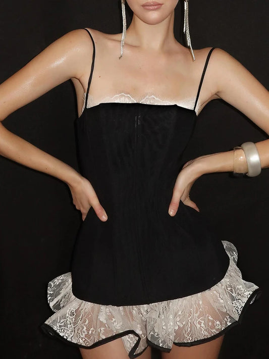 Black satin nightgown with lace details on a black background