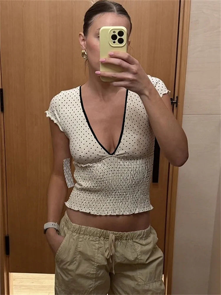 Women's white V-neck printed short sleeve top.