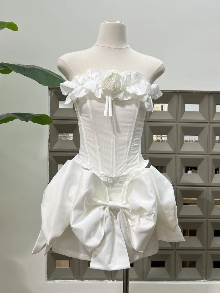 White dress on a mannequin against a neutral background