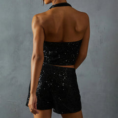 Person wearing a black sequin outfit -back view