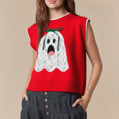 Red sleeveless sweater with a ghost design worn by a person on a beige background