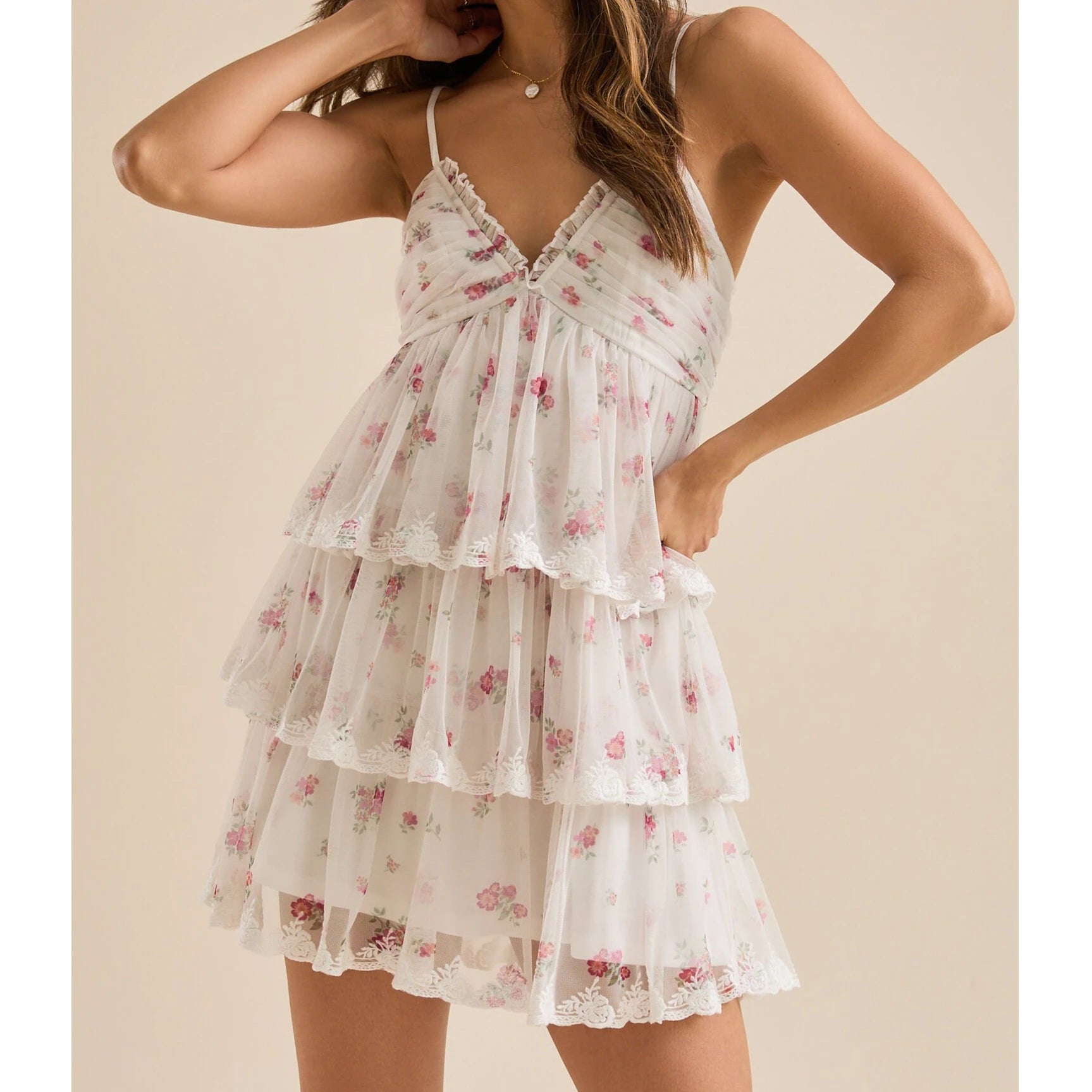 Woman wearing a floral tiered dress - side