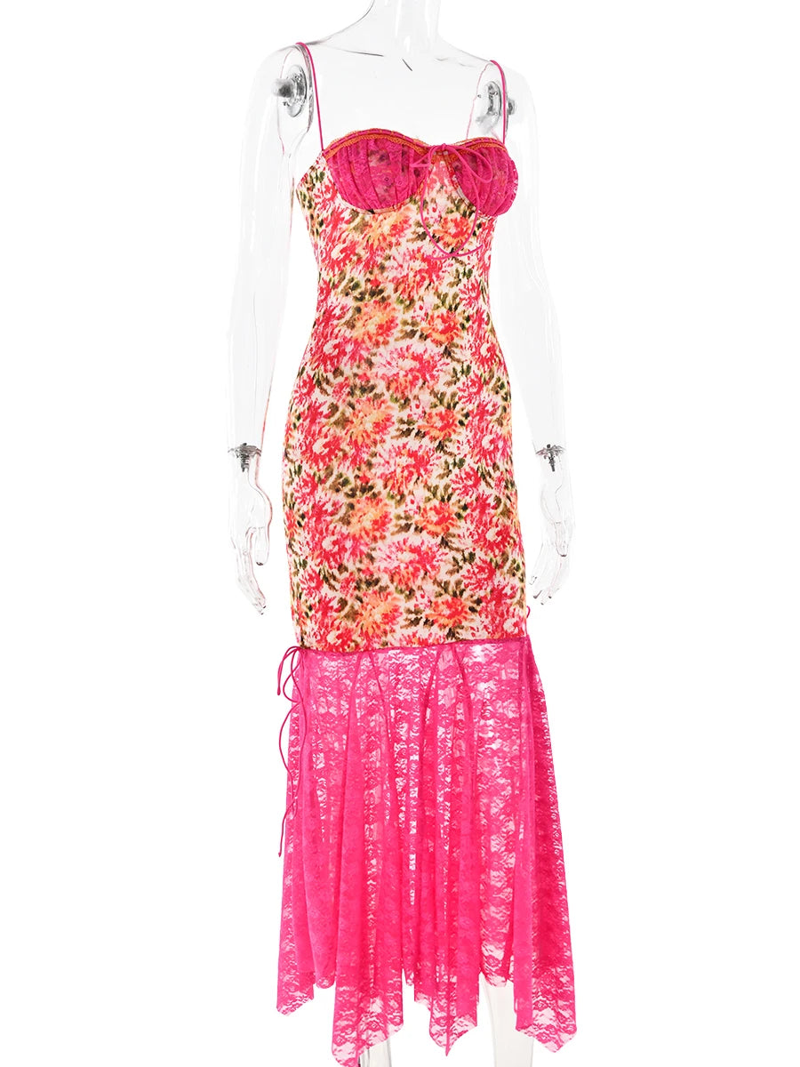 Floral dress with pink lace overlay on a mannequin against a white background