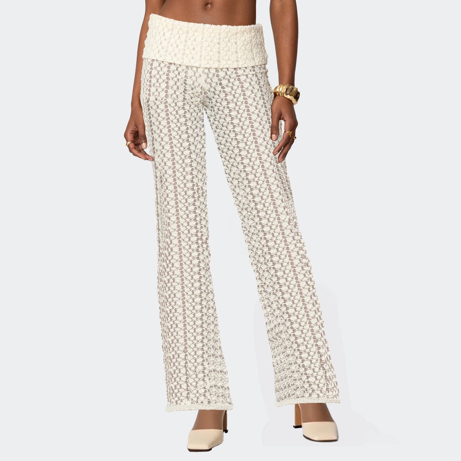 White patterned pants worn by a person on a white background