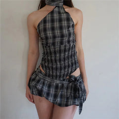 Plaid dress worn by a person against a plain background