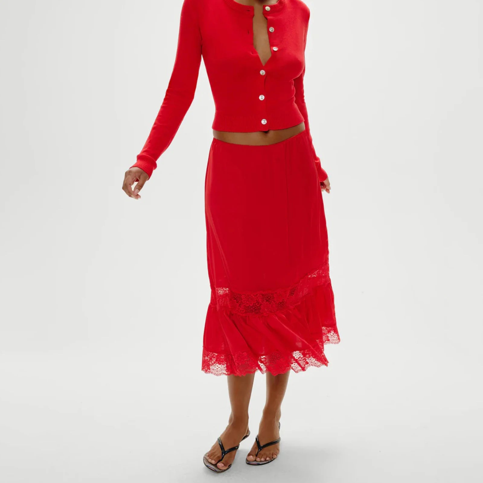 Red outfit with a lace-trimmed skirt