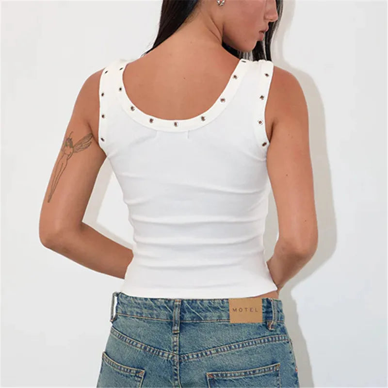 White tank top with decorative studs worn by a person