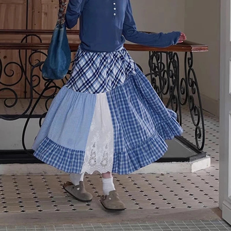 Women's plaid patchwork midi skirt with lace decoration and A-line silhouette.