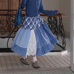 Women's plaid patchwork midi skirt with lace decoration and A-line silhouette.