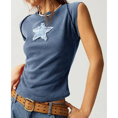 Model displaying a short round neck tank top with star appliques in a patchwork pattern.