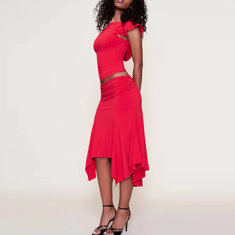 Red dress with cut-out design worn by a model on a plain background