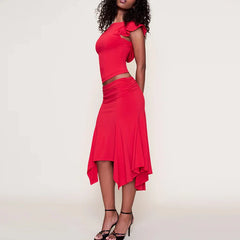Red dress with cut-out design worn by a model on a plain background