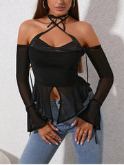Black off-shoulder top with sheer sleeves and blue jeans on a neutral background