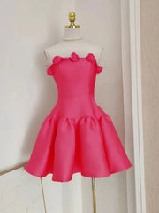 Pink dress on a mannequin against a neutral wall