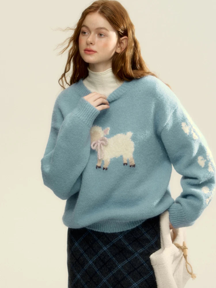 Woman wearing a light blue sweater with sheep designs