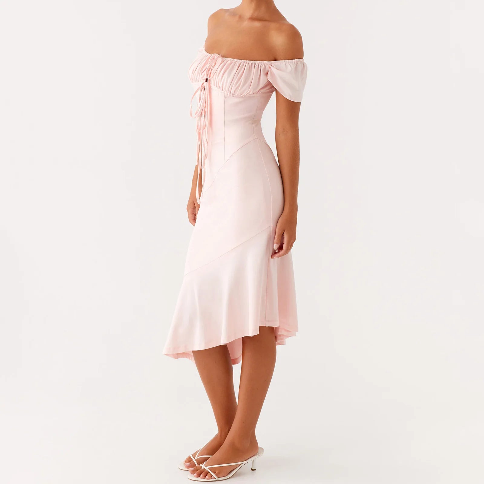 Woman wearing a light pink off-shoulder dress