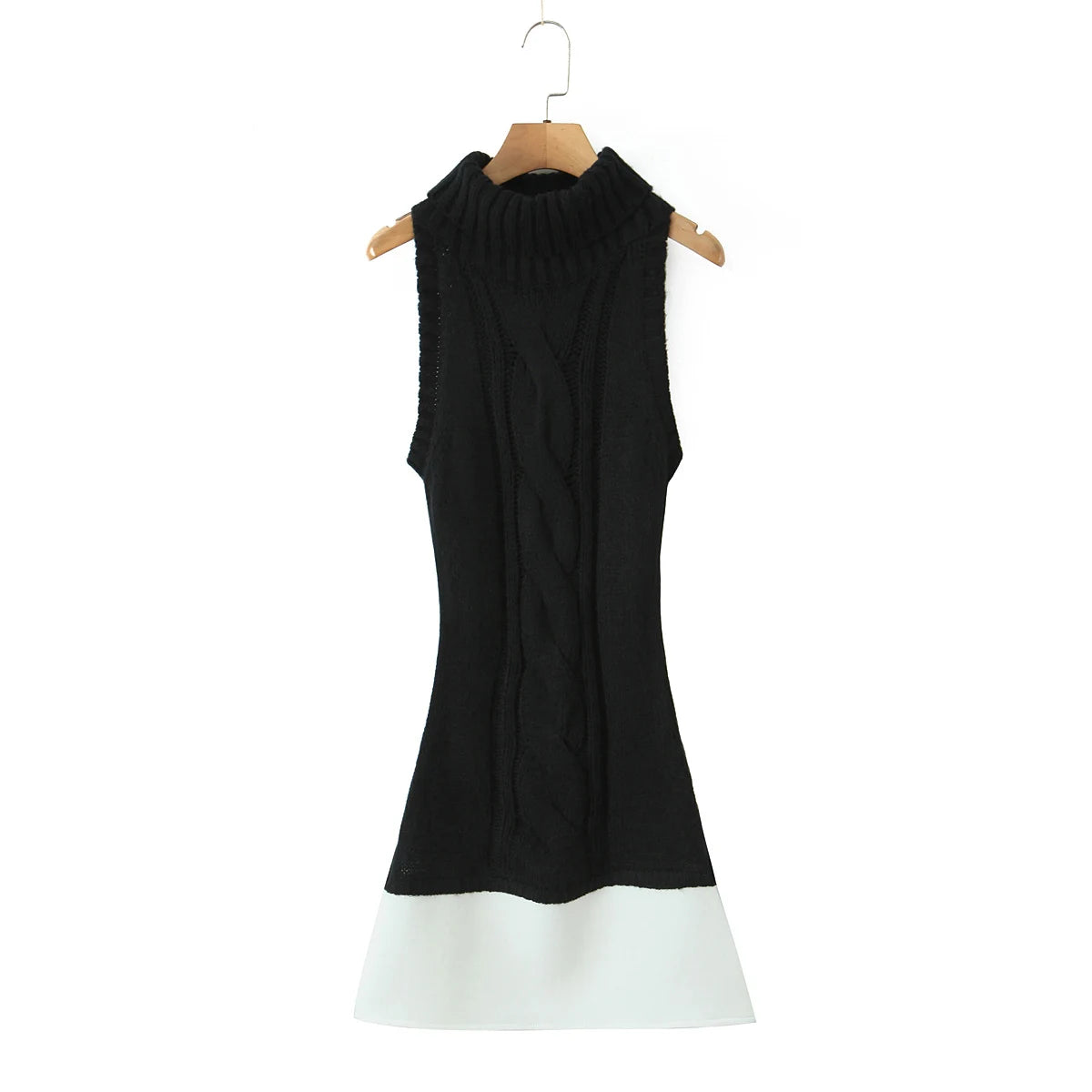 Black sleeveless dress with white hem on a hanger against a white background