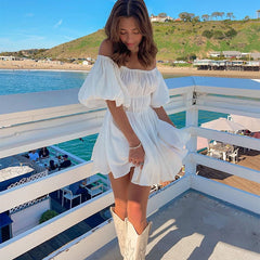 Women's off-shoulder ruched A-line mini dress with puff sleeves.